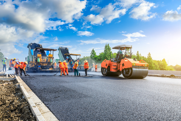 Asphalt paving contractors in Palm Beach County laying new asphalt road