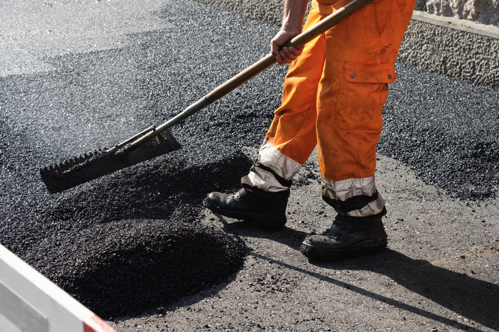 Asphalt Paving Contractor the road with porous asphalt